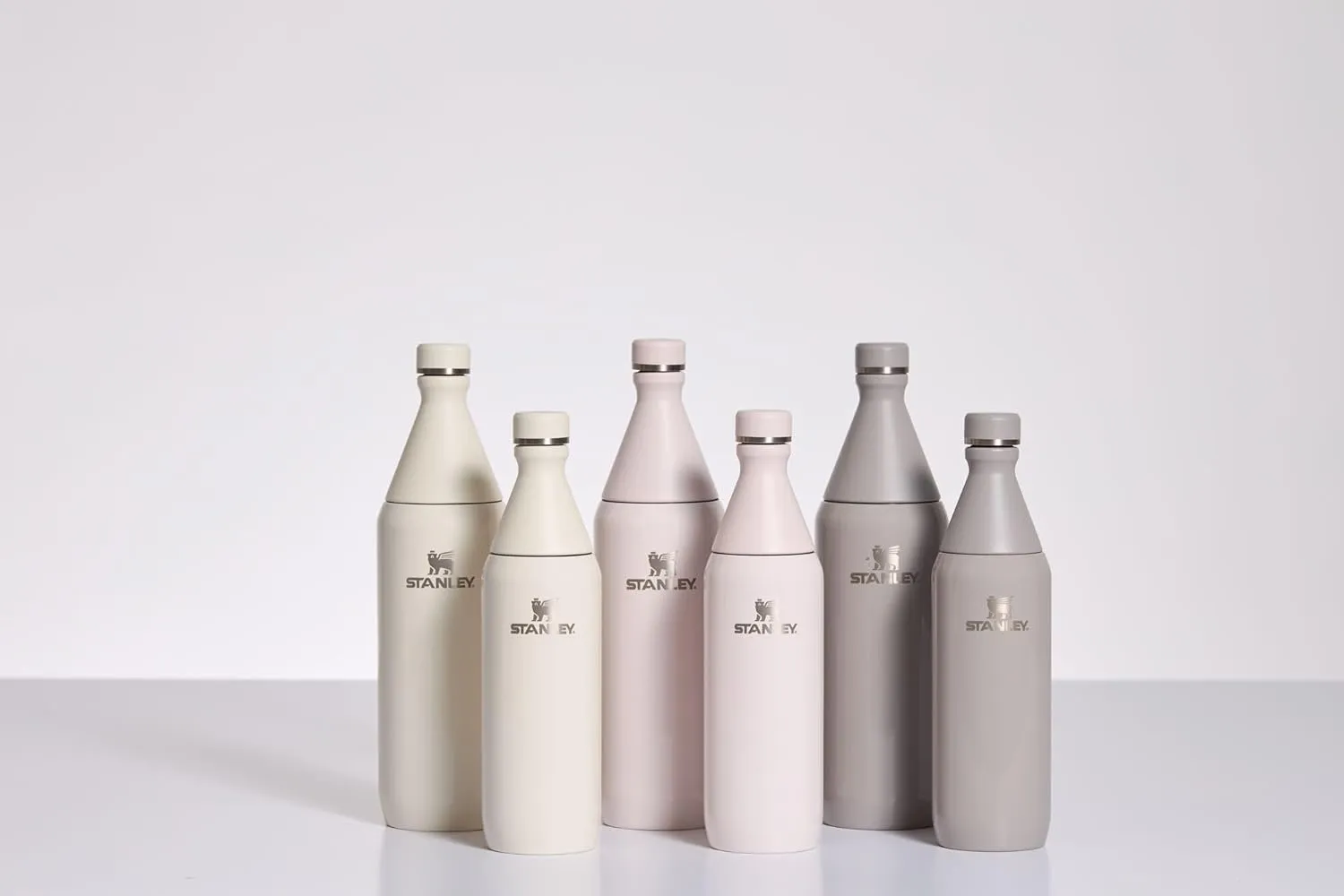 Stanley All Day Slim Bottle 34 oz | Leakproof Twist on Lid | Slim Design for Travel and Gym | Insulated Stainless Steel Water Bottle | BPA-Free | Cream Gloss